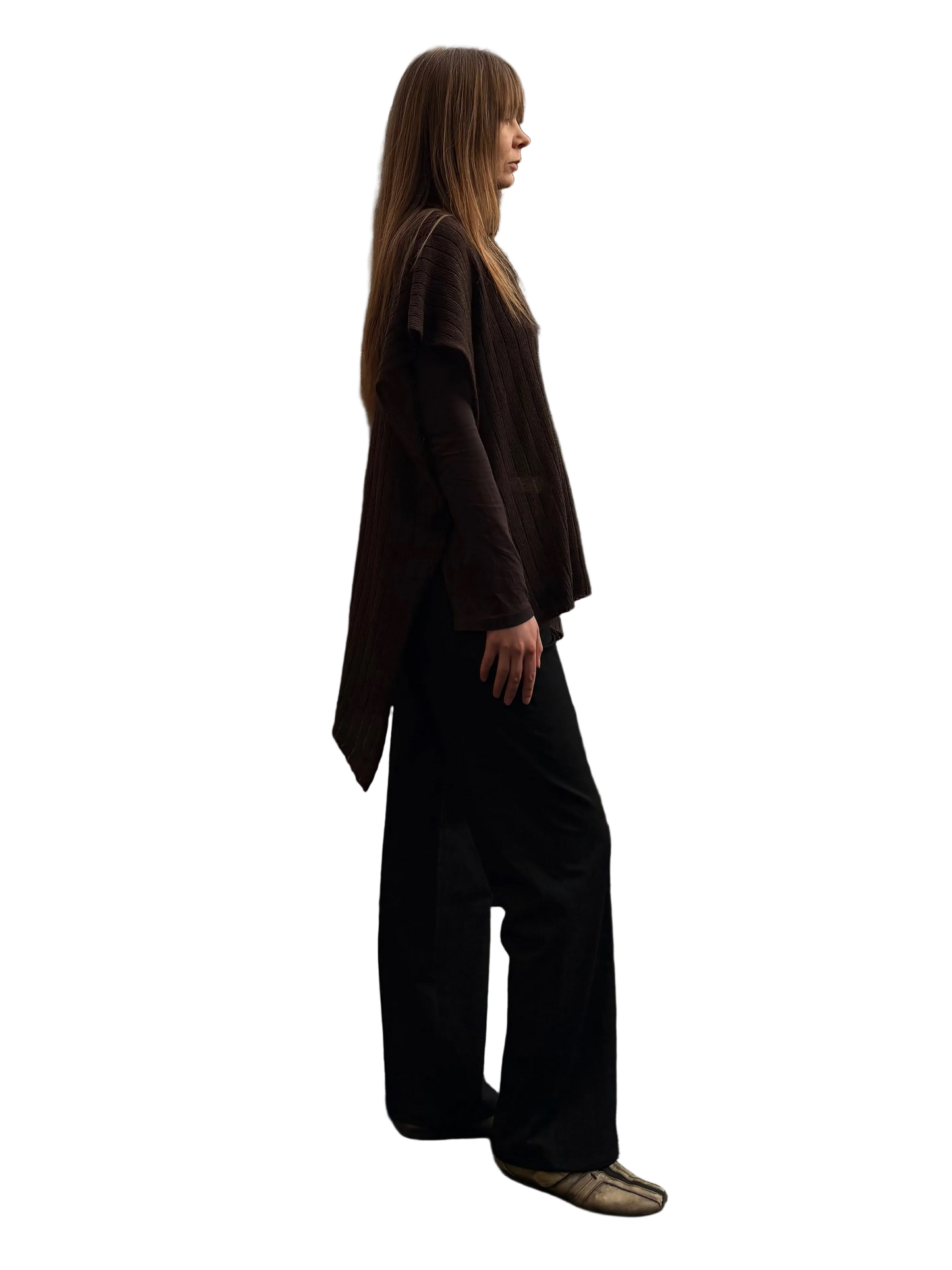 Woman standing on a rooftop with wooden panels and buildings in the background